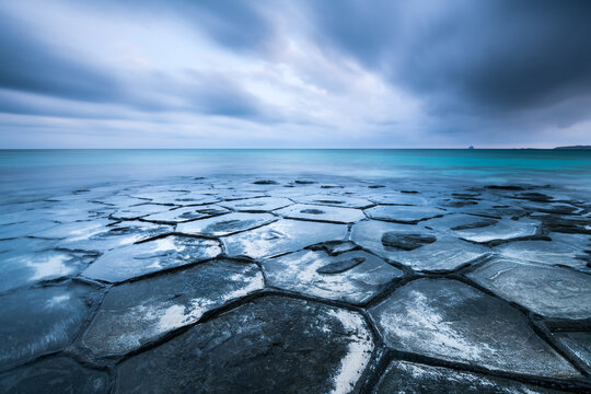 Tatami ishi rocks on a cloudy day, Kumejima island, Okinawa, Japan