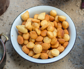 Traditional Kazakh Asian baursak dish prepared with dough on a pan with oil