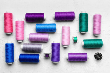 Sewing threads on light background