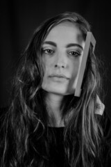 Proud of my long natural hair - Young beautiful girl holding a small frame in her hand in her long natural hair