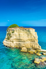 Naklejka premium Beautiful cliffs and sea stacks of Sant'Andrea on the crystal clear waters of Salento, Apulia Italy