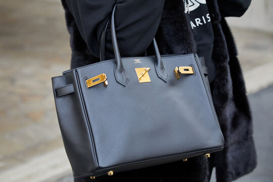 Woman with black leather Hermes bag, Milan February 24 2022