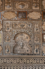 Splendid design in Sheesh Mahal of  ancient Amer fort of Jaipur, India