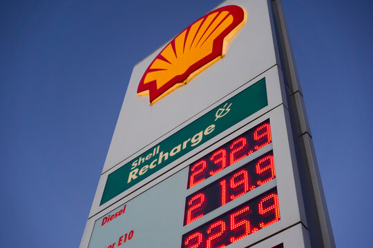 Close up of Price board with high gasoline, diesel and fuel prices. Most expensive gas and oil prices at German shell filling station in Europe.