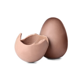 Broken tasty chocolate Easter egg on white background