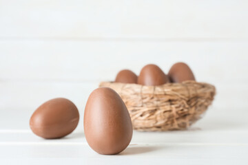 Yummy chocolate Easter eggs on light background