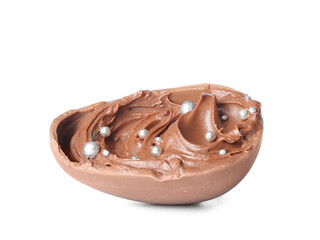 Half of chocolate Easter egg with paste on white background