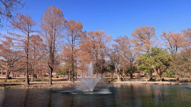 Sunny exterior view of the Theta Pond of Oklahoma State University