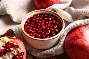 Bowl of pomegranate molasses on table