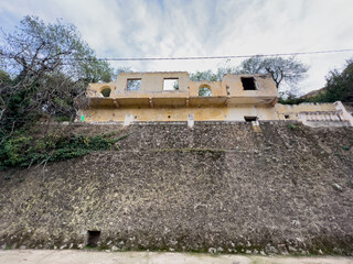 Low angle view of an abandoned house