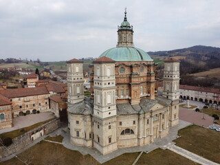 Vicoforte, Italy - March 5, 2022: aerial drone view of Vicoforte Sanctuary in northern Italy, no people are visible. Background is a cloudy sky.