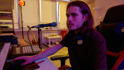 Musician record music on computer at home studio