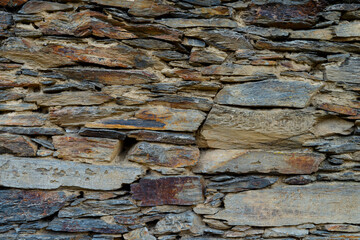 Stone and clay wall texture. Natural stone background.