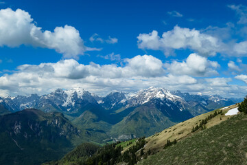 Fototapeta na wymiar Panoramic view in spring from Frauenkogel on mount Mangart in the Julian Alps, Friuli, Italy. Border Austria, Italy, Slovenia. Triglav National Park. Upper Drava valley. Summit