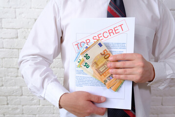 Secret documents and money. Bribery and corruption concepts