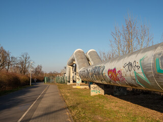 Ground heat pipes. A pipeline above ground that conducts heat to cities.