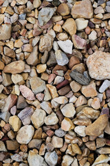 Stones of different sizes and colors. Image can be used as wallpaper.Vertical composition.