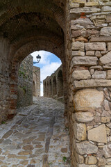 castle gate and walls in the historic city center of Castello de Castellar