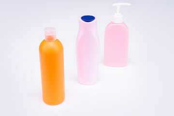 Easy to use. Toiletry bottles. Refillable bottles isolated on white. Beauty products packaging