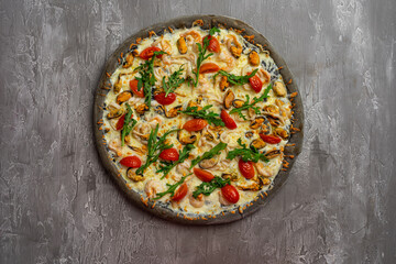 Delicious seafood pizza on light grey table, top view. Space for text