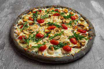Delicious seafood pizza on light grey table, top view. Space for text