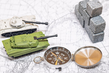 Toy models of tanks jointly attack enemy fortifications