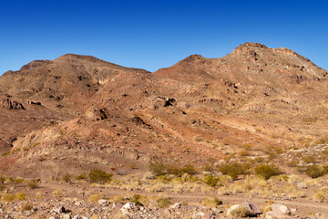 Southern Nevada desert mountain range with blue sky