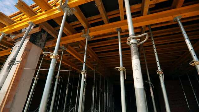 The process of creating a floor. Formwork flooring. Exterior of a building under construction. Formwork rack