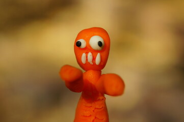 Funny colorful zombies close-up. Monsters made of plasticine. Crafts for Halloween.