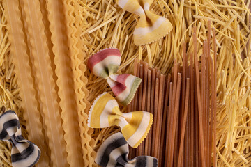 Various raw pasta and spagetti Traditional Italian cuisine. Top view.