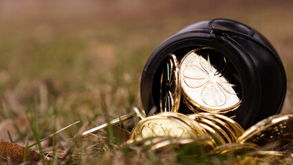Leprechaun's pot of gold outside with copy space. Image can be used as a St. Patrick's Day background or template.