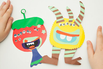 Children made paper alien monsters. Home activities for children during bad weather or during...