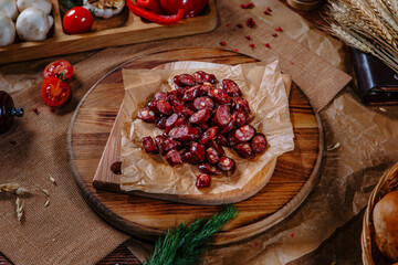 Fried black-blooded Bavarian sausages in small pieces. Top view