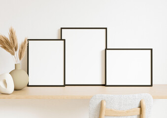 Boho Style Vertical and Horizontal 8x10 three Black Frames mockup. Clean Black frame on a wooden desk and chair with boho plant and a vase. 3d rendering.