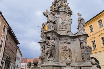Fototapeta na wymiar Kutna Hora, Central Bohemia, Czech Republic, 5 March 2022: Plague Column of Virgin Mary Immaculate, column and baroque statues of saints and apostles, medieval architecture gothic and renaissance