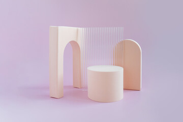Beige geometric shapes on a lilac bright background with space for text and design. Minimalistic composition of beige geometric shapes of the arch, cube. Abstract composition for any text.