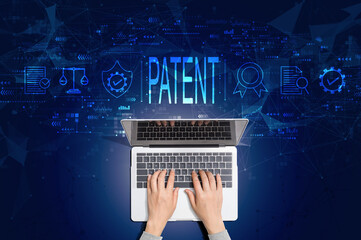 Patent concept with person using a laptop computer