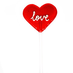 Heart lollipop on a stick with the inscription love