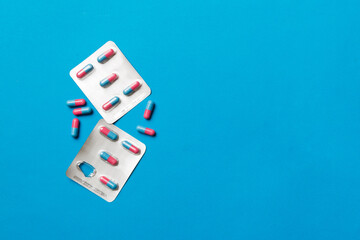 Protective face masks or surgical masks, medicine pills and thermometer on table background. Coronavirus disease. Corona virus concept. Space for text