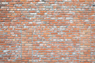 old brick wall made of aged red and white bricks. Vintage. Surface.Backdrop. Background.