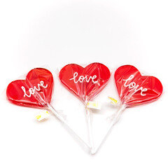 heart lollipop on a stick with the inscription love in the package