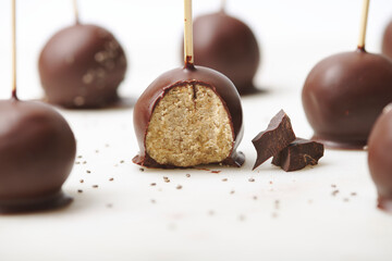 Delicious chocolate balls with chia seeds. Healthy and delicious dessert made with cacao and organic ingredients. Sweet truffles.