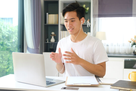 Young man working and studying online at home. 