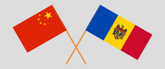 Crossed flags of China and Moldova. Official colors. Correct proportion