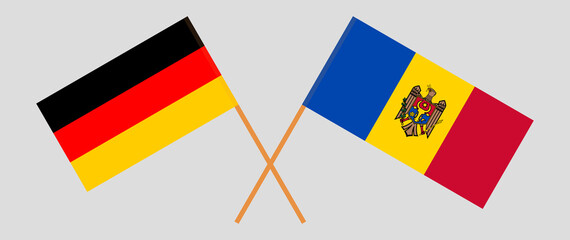 Crossed flags of Germany and Moldova. Official colors. Correct proportion