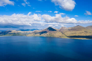 Scottish mountains with sea water on a sunny day, aerial shot, Isle of Mull