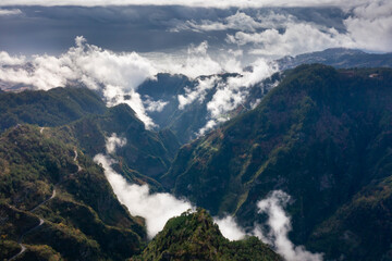 Fototapeta premium View into the valley of nuns in Madeira, Portugal. Mountains with dramatic clouds. 