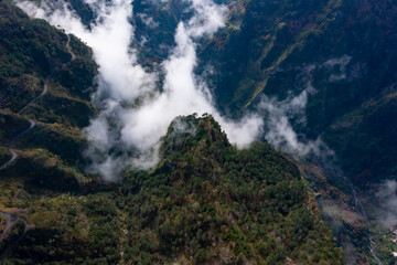 View into the valley of nuns in Madeira, Portugal. Mountains with dramatic clouds. 