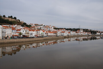 Fototapeta na wymiar Alcácer do Sal panoramic view with reflection in the river
