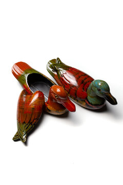 Wooden ducks. Carved ducks from wood. High quality photo